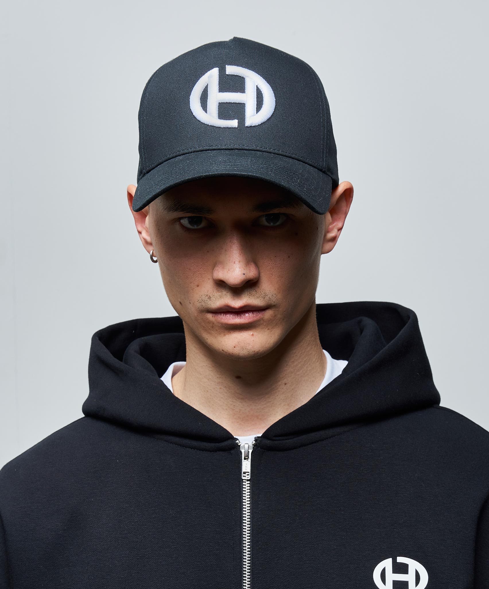OVAL EMBROIDERED 3D TRUCKER CAP - BLACK