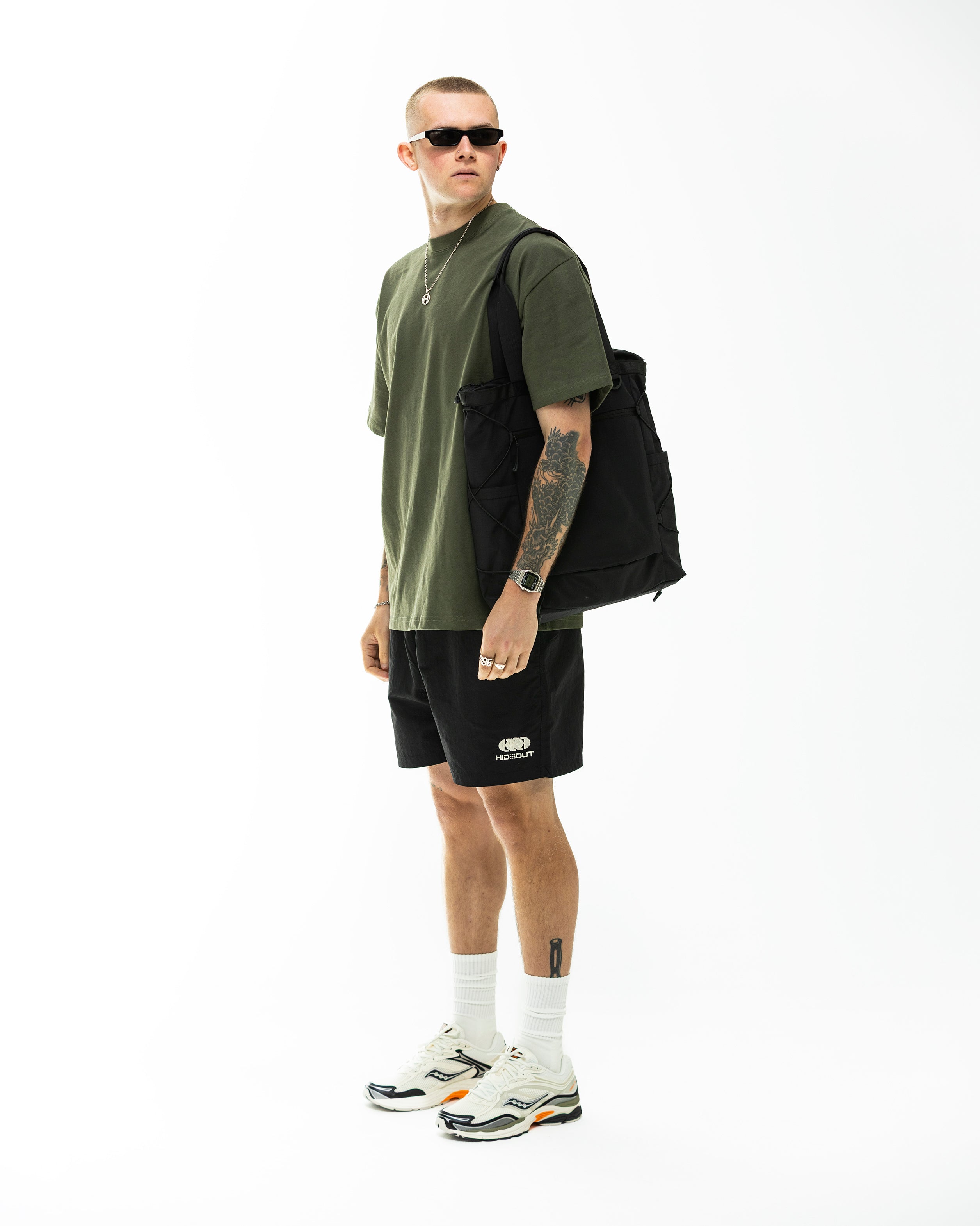 Model wearing Hidden Hideout Blank tee-Oversized Fit-Olive Green