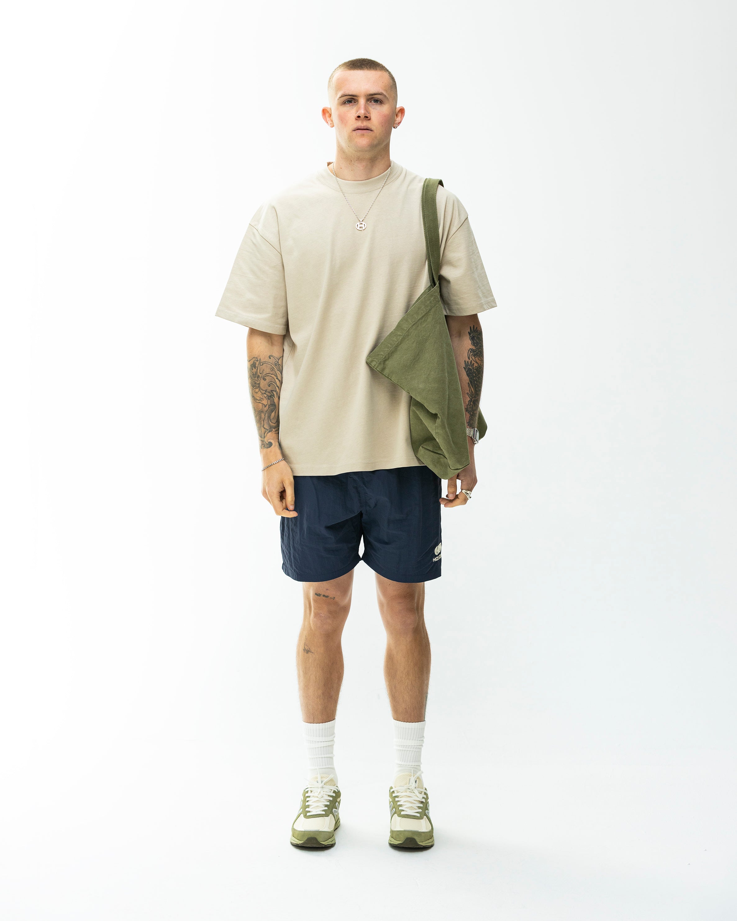 Model wearing Hidden Hideout Blank tee-Oversized Fit-Stone