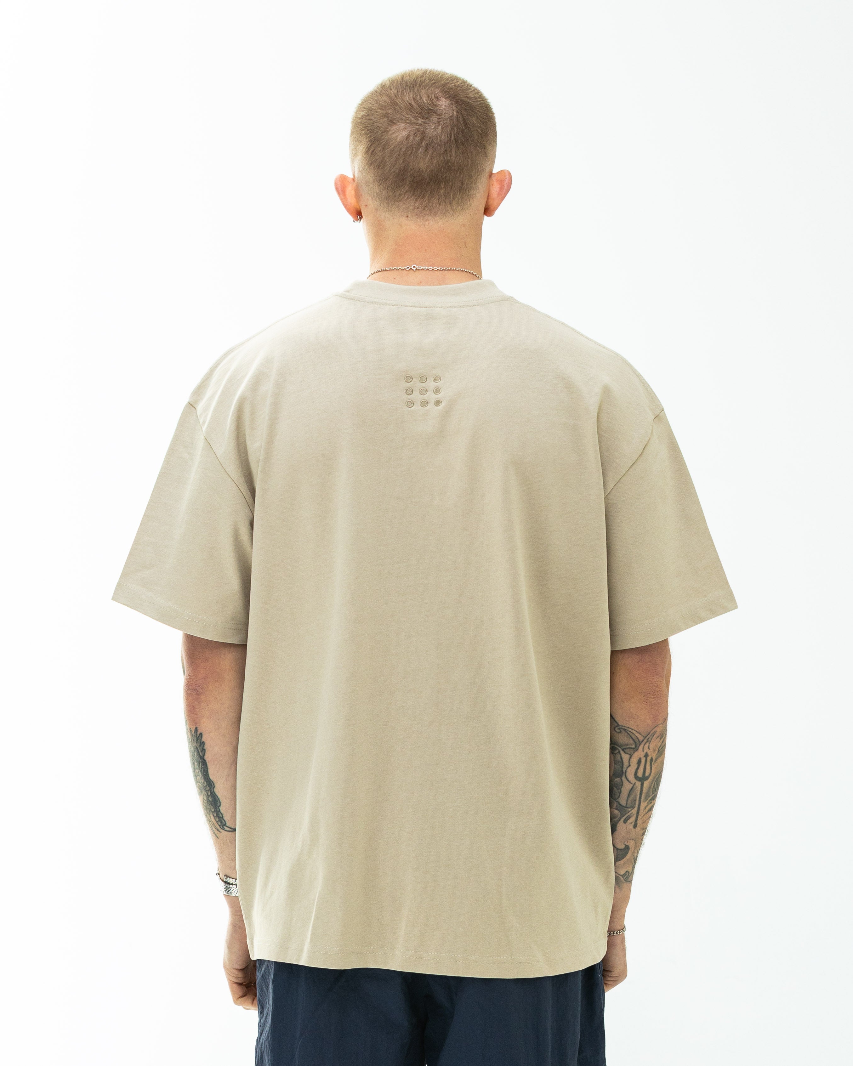 Back of Hidden Hideout Blank tee-Oversized Fit-Stone
